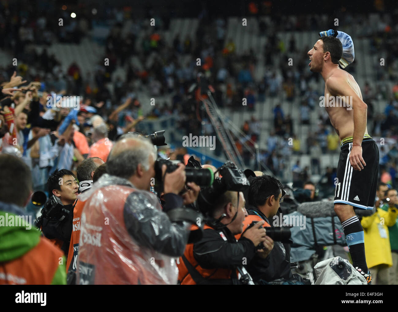 Sao Paulo, Brazil. 09th July, 2014. Argentina's Maxi Rodriguez (R) after winning the penalty shoot-out of the FIFA World Cup 2014 semi-final soccer match between the Netherlands and Argentina at the Arena Corinthians in Sao Paulo, Brazil, 09 July 2014. Photo: Marius Becker/dpa/Alamy Live News Stock Photo