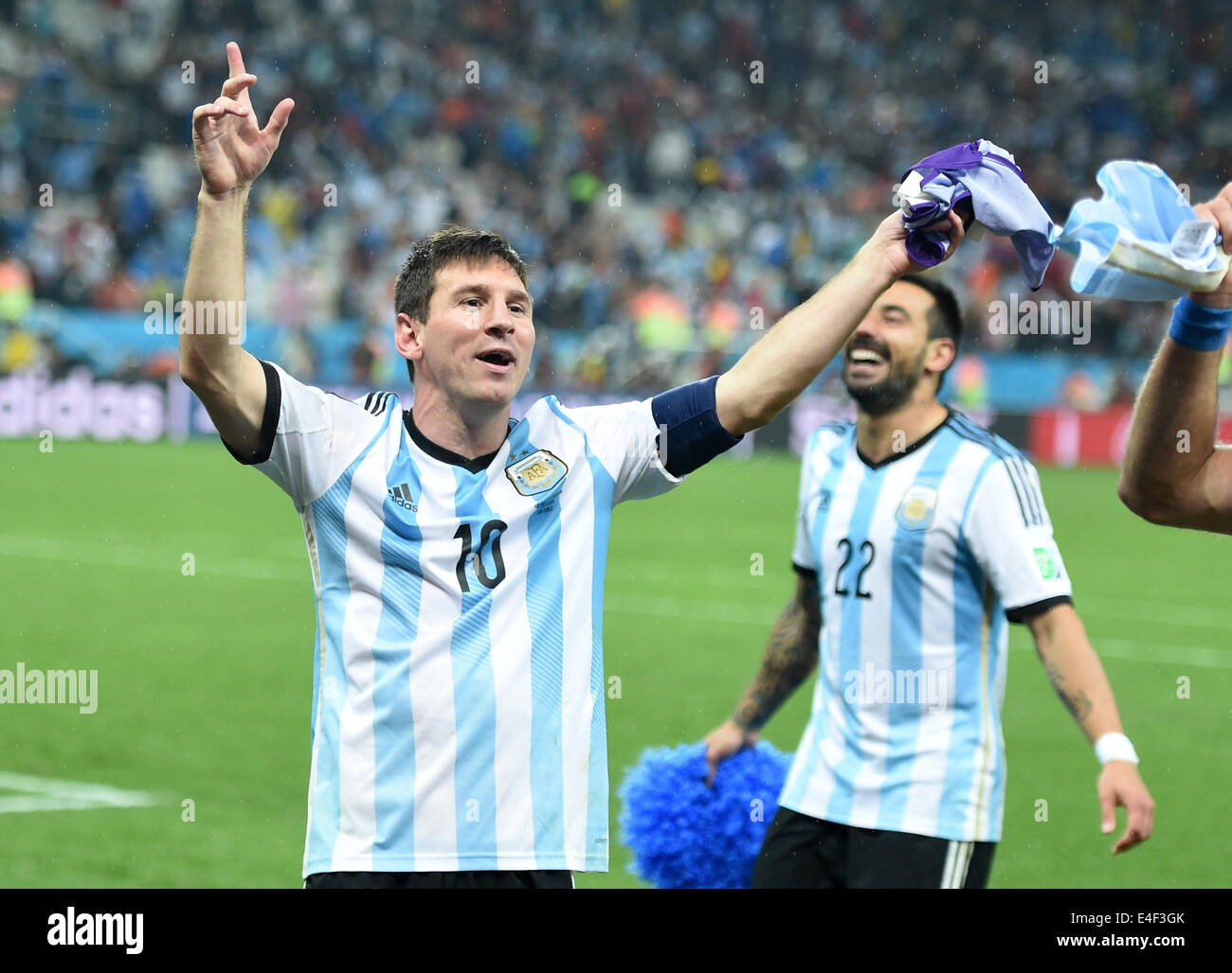 Sao Paulo, Brazil. 09th July, 2014. Argentina's Lionel Messi (L) and Ezequiel Lavezzi celebrate after winning the penalty shoot-out of the FIFA World Cup 2014 semi-final soccer match between the Netherlands and Argentina at the Arena Corinthians in Sao Paulo, Brazil, 09 July 2014. Photo: Marius Becker/dpa/Alamy Live News Stock Photo