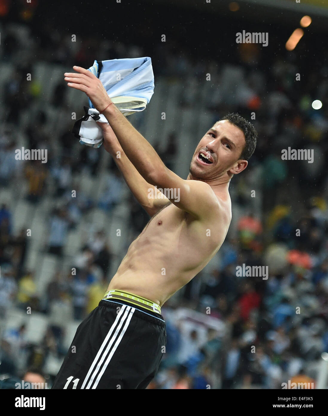 Sao Paulo, Brazil. 09th July, 2014. Argentina's Maxi Rodriguez celebrates after winning the penalty shoot-out of the FIFA World Cup 2014 semi-final soccer match between the Netherlands and Argentina at the Arena Corinthians in Sao Paulo, Brazil, 09 July 2014. Photo: Marius Becker/dpa/Alamy Live News Stock Photo