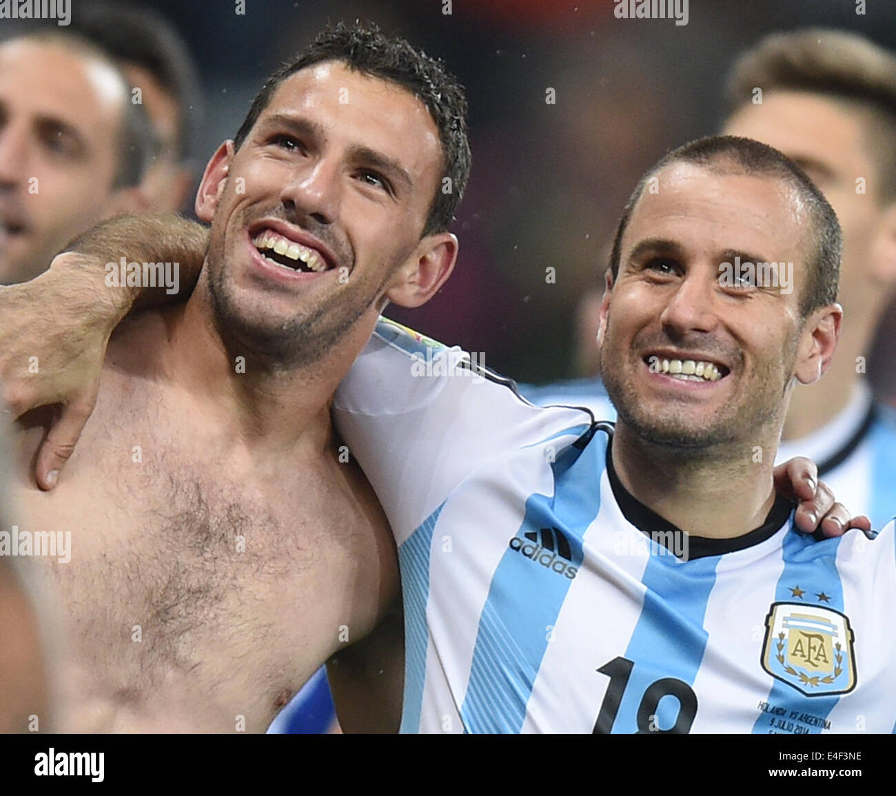 Sao Paulo, Brazil. 09th July, 2014. Argentina's Maxi Rodriguez (L) celebrates with his team mate Rodrigo Palacio after winning the penalty shoot-out of the FIFA World Cup 2014 semi-final soccer match between the Netherlands and Argentina at the Arena Corinthians in Sao Paulo, Brazil, 09 July 2014. Photo: Marius Becker/dpa/Alamy Live News Stock Photo