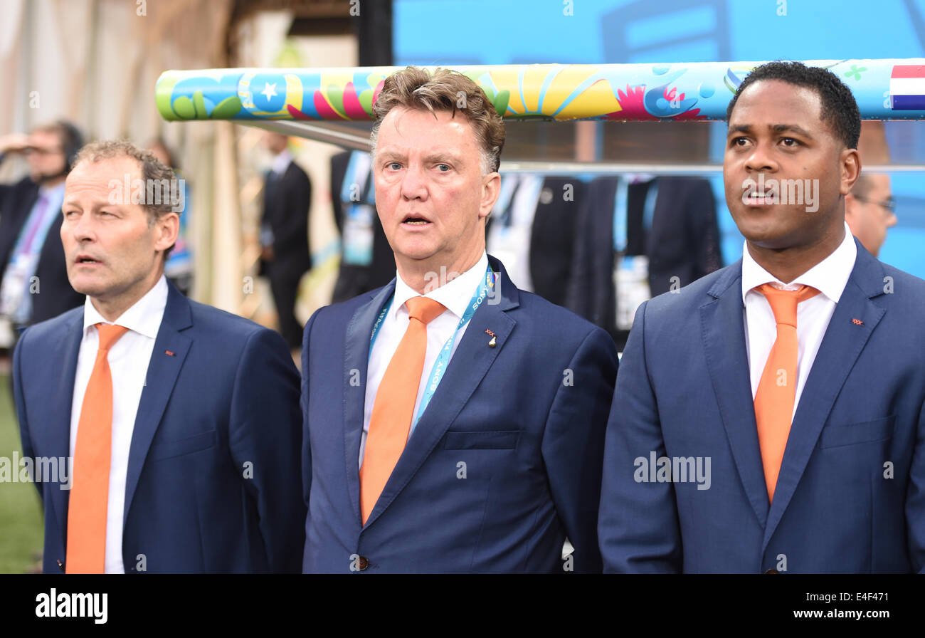 Sao Paulo, Brazil. 09th July, 2014. Dutch head coach Louis van Gaal (C) and his assistant coaches Danny Blind (L) and Patrick Kluivert (R) seen during the FIFA World Cup 2014 semi-final soccer match between the Netherlands and Argentina at the Arena Corinthians in Sao Paulo, Brazil, 09 July 2014. Photo: Marius Becker/dpa/Alamy Live News Stock Photo