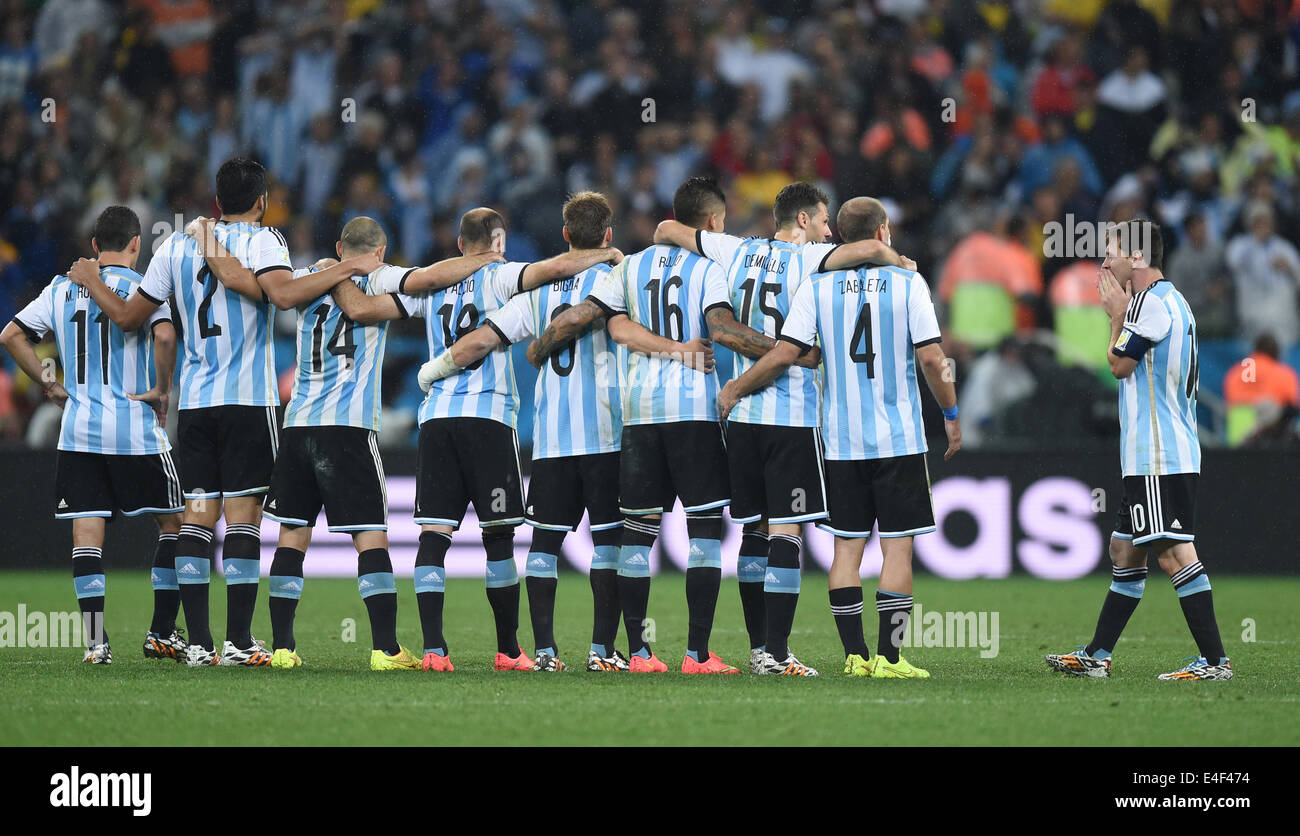 Sao Paulo, Brazil. 09th July, 2014. Argentine players with Lionel Messi (R) seen during the penalty shoot-out of the FIFA World Cup 2014 semi-final soccer match between the Netherlands and Argentina at the Arena Corinthians in Sao Paulo, Brazil, 09 July 2014. Photo: Marius Becker/dpa/Alamy Live News Stock Photo
