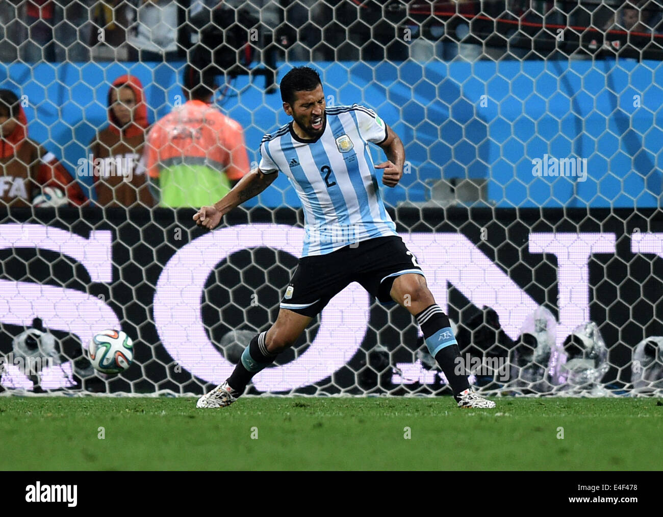 Sao Paulo, Brazil. 09th July, 2014. Argentina's Ezequiel Garay celebrates after scoring the 1-2 goal during the penalty shoot-out during the FIFA World Cup 2014 semi-final soccer match between the Netherlands and Argentina at the Arena Corinthians in Sao Paulo, Brazil, 09 July 2014. Photo: Marius Becker/dpa/Alamy Live News Stock Photo