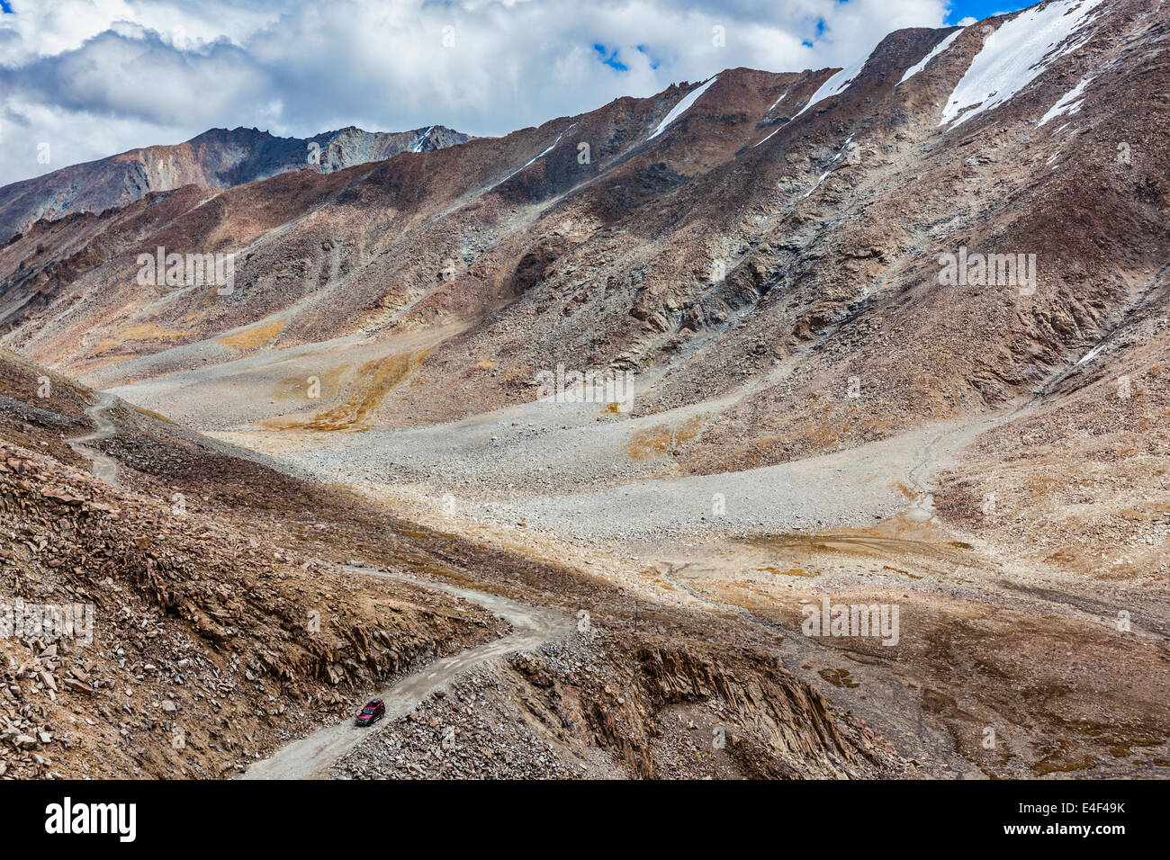 Himalayan valley landscape with road near Kunzum La pass - allegedly the highest motorable pass in the world (5602 m), Ladakh Stock Photo