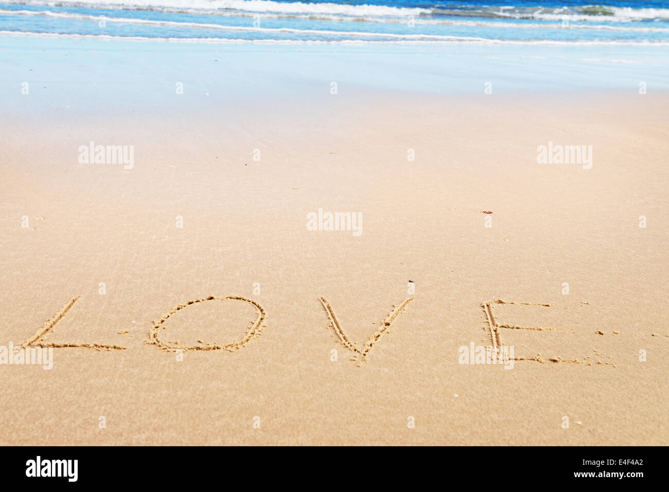 Love message on the beach sand - love and  romantic concept Stock Photo