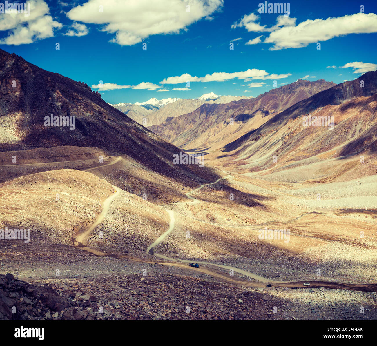 Vintage retro effect filtered hipster style travel image of Himalayan valley landscape with road near Kunzum La pass - allegedly Stock Photo