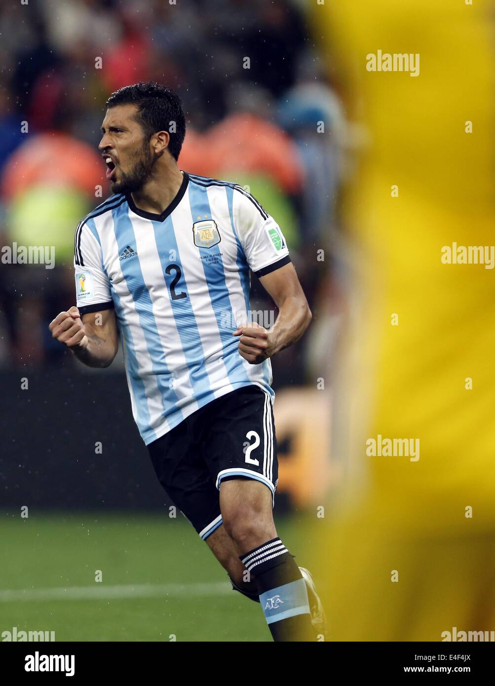 Sao Paulo, Brazil. 9th July, 2014. Argentina's Ezequiel Garay celebrates after scoring in the penalty shoot-out during a semifinal match between Netherlands and Argentina of 2014 FIFA World Cup at the Arena de Sao Paulo Stadium in Sao Paulo, Brazil, on July 9, 2014. Argentina won 4-2 on penalties over Netherlands after a 0-0 tie and qualified for the final on Wednesday. Credit:  Wang Lili/Xinhua/Alamy Live News Stock Photo