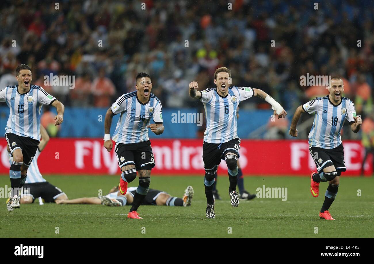 Sao Paulo, Brazil. 9th July, 2014. Argentina's Martin Demichelis, Marcos Rojo, Lucas Biglia and Rodrigo Palacio (L to R, front) celebrate their victory at the end of the penalty shoot-out of a semifinal match between Netherlands and Argentina of 2014 FIFA World Cup at the Arena de Sao Paulo Stadium in Sao Paulo, Brazil, on July 9, 2014. Argentina won 4-2 on penalties over Netherlands after a 0-0 tie and qualified for the final on Wednesday. Credit:  Wang Lili/Xinhua/Alamy Live News Stock Photo