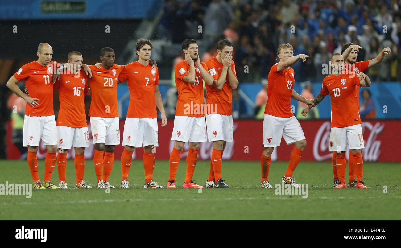 Sao Paulo, Brazil. 9th July, 2014. Netherlands' Arjen Robben, Jordy Clasie, Georginio Wijnaldum, Daryl Janmaat, Klaas-Jan Huntelaar, Stefan de Vrij, Dirk Kuyt, Wesley Sneijder and Daley Blind (L to R) react in the penalty shoot-out during a semifinal match between Netherlands and Argentina of 2014 FIFA World Cup at the Arena de Sao Paulo Stadium in Sao Paulo, Brazil, on July 9, 2014. Argentina won 4-2 on penalties over Netherlands after a 0-0 tie and qualified for the final on Wednesday. Credit:  Wang Lili/Xinhua/Alamy Live News Stock Photo