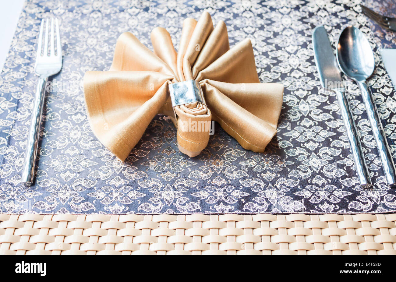 Dining table setting with fork, knife, spoon and napkin Stock Photo Alamy
