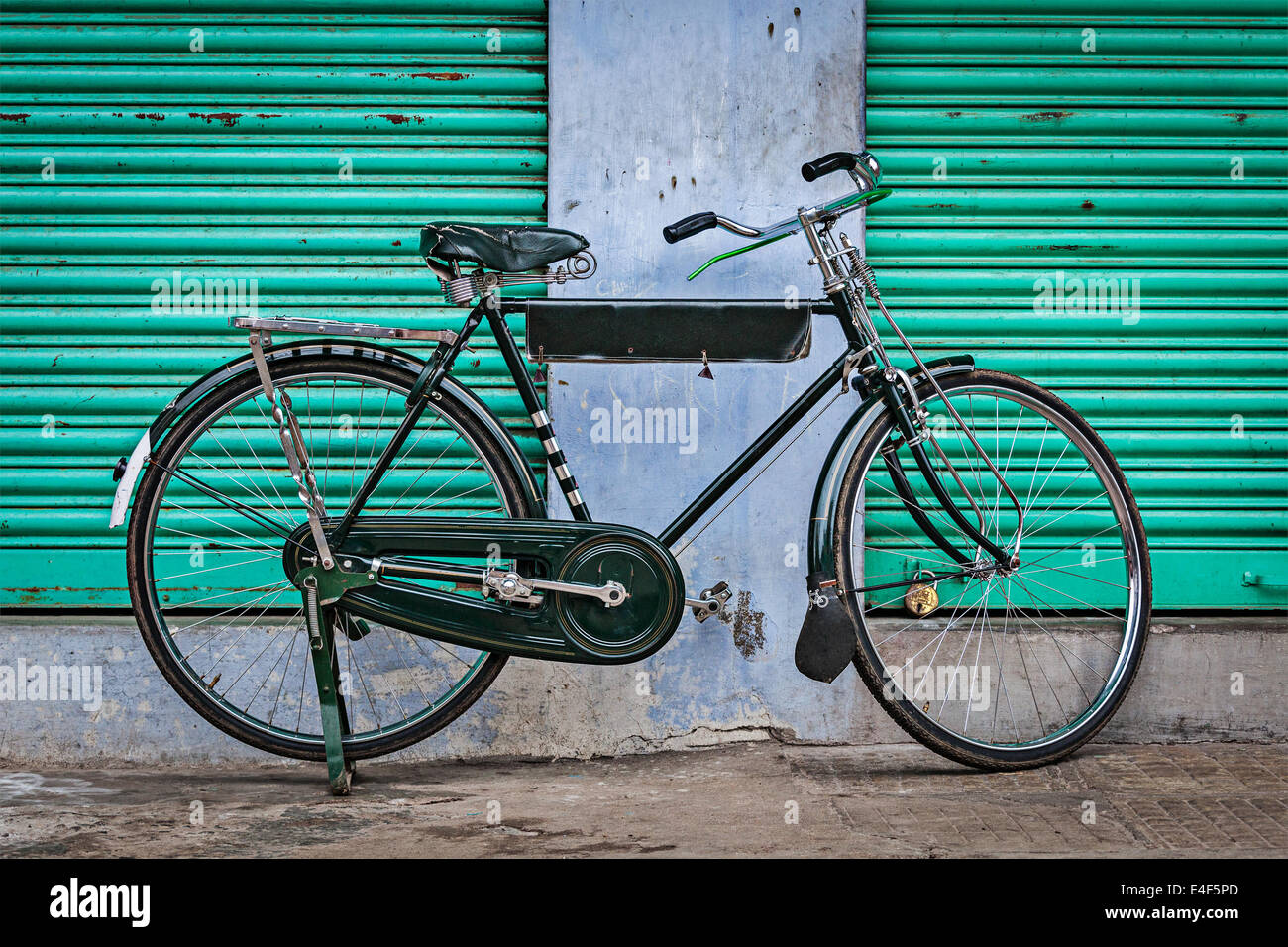 Old Indian bicycle in the street of India Stock Photo