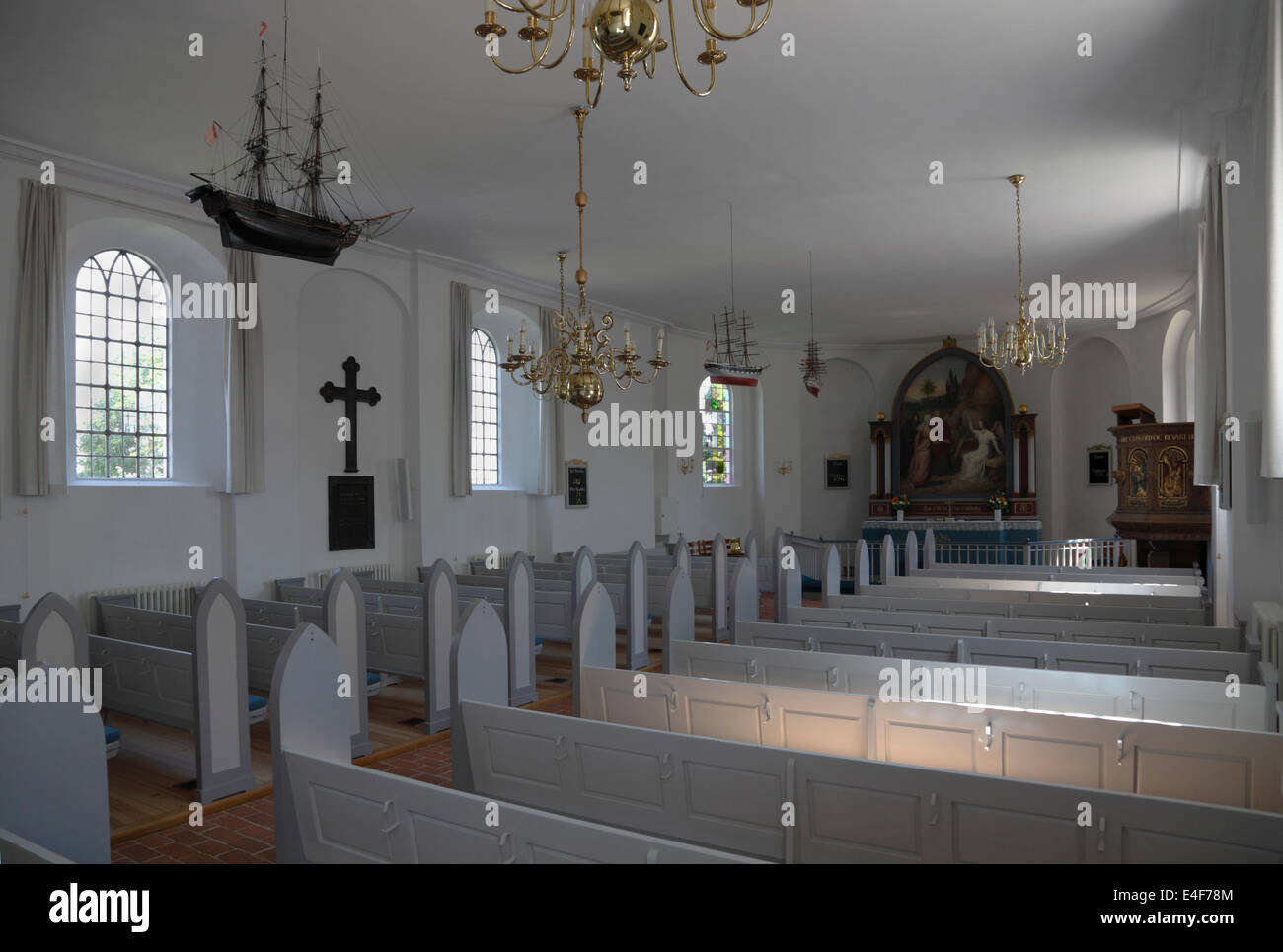 Nave, votive ship model, pews, pulpit and altar in Gilleleje Church