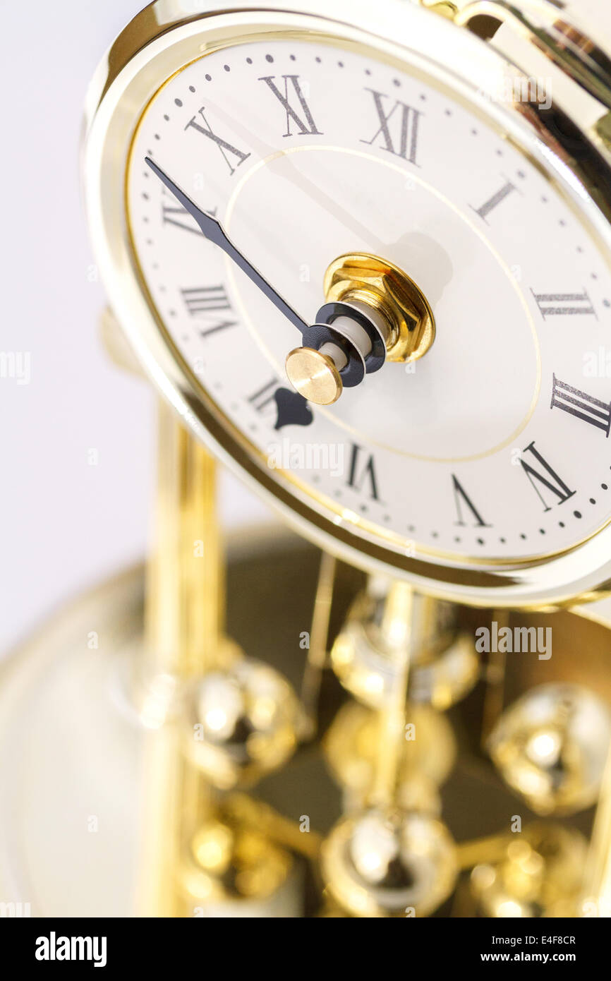 Period clock with oscillating mechanism Stock Photo