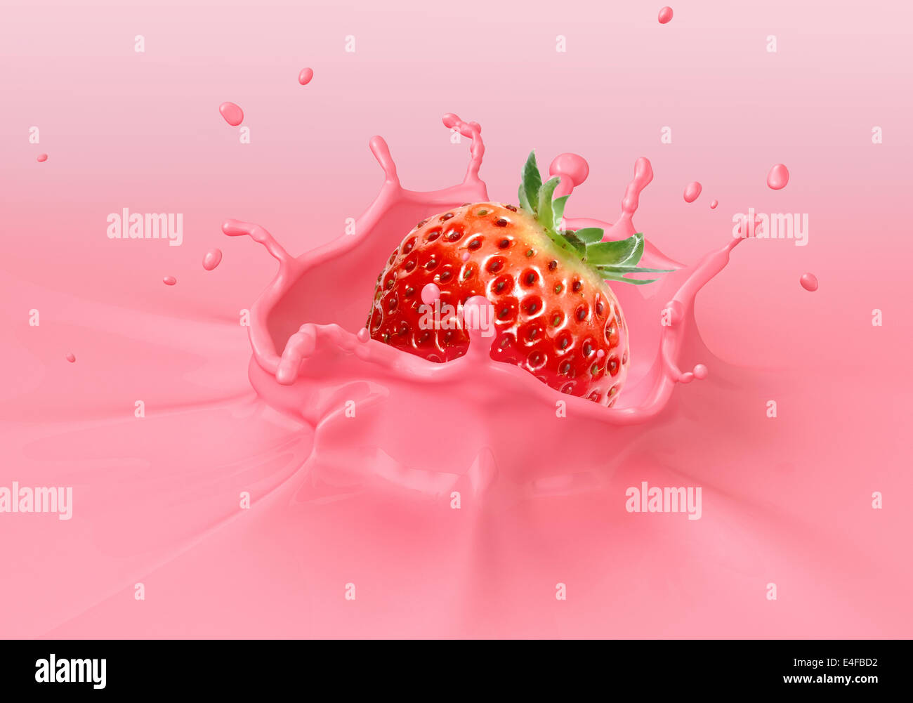 Strawberry falling into pink creamy liquid splashing. Close up view. Stock Photo