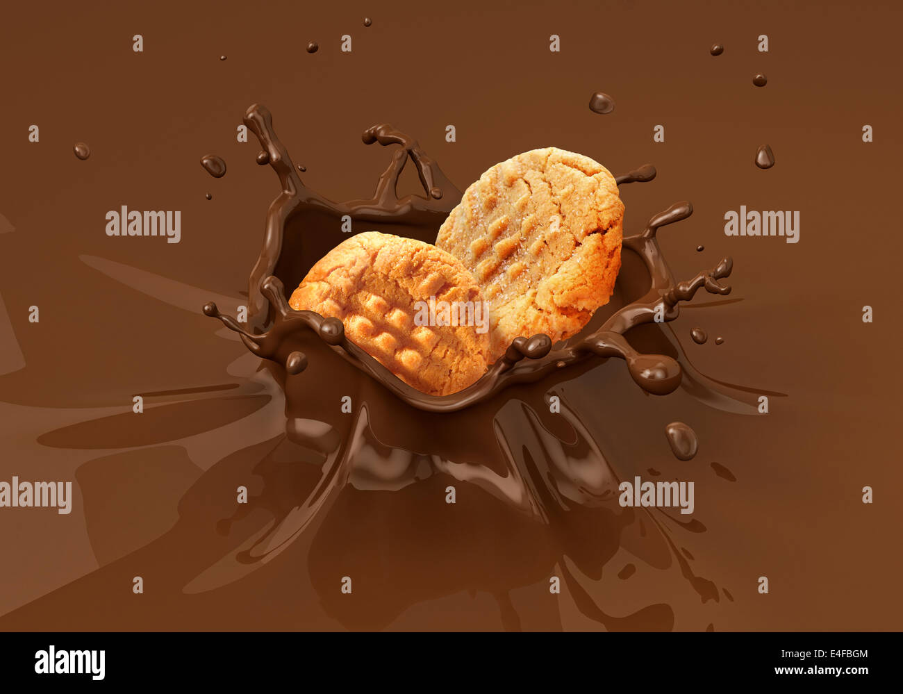 Two cookies biscuits falling into liquid chocolate splashing. Close up view. Stock Photo