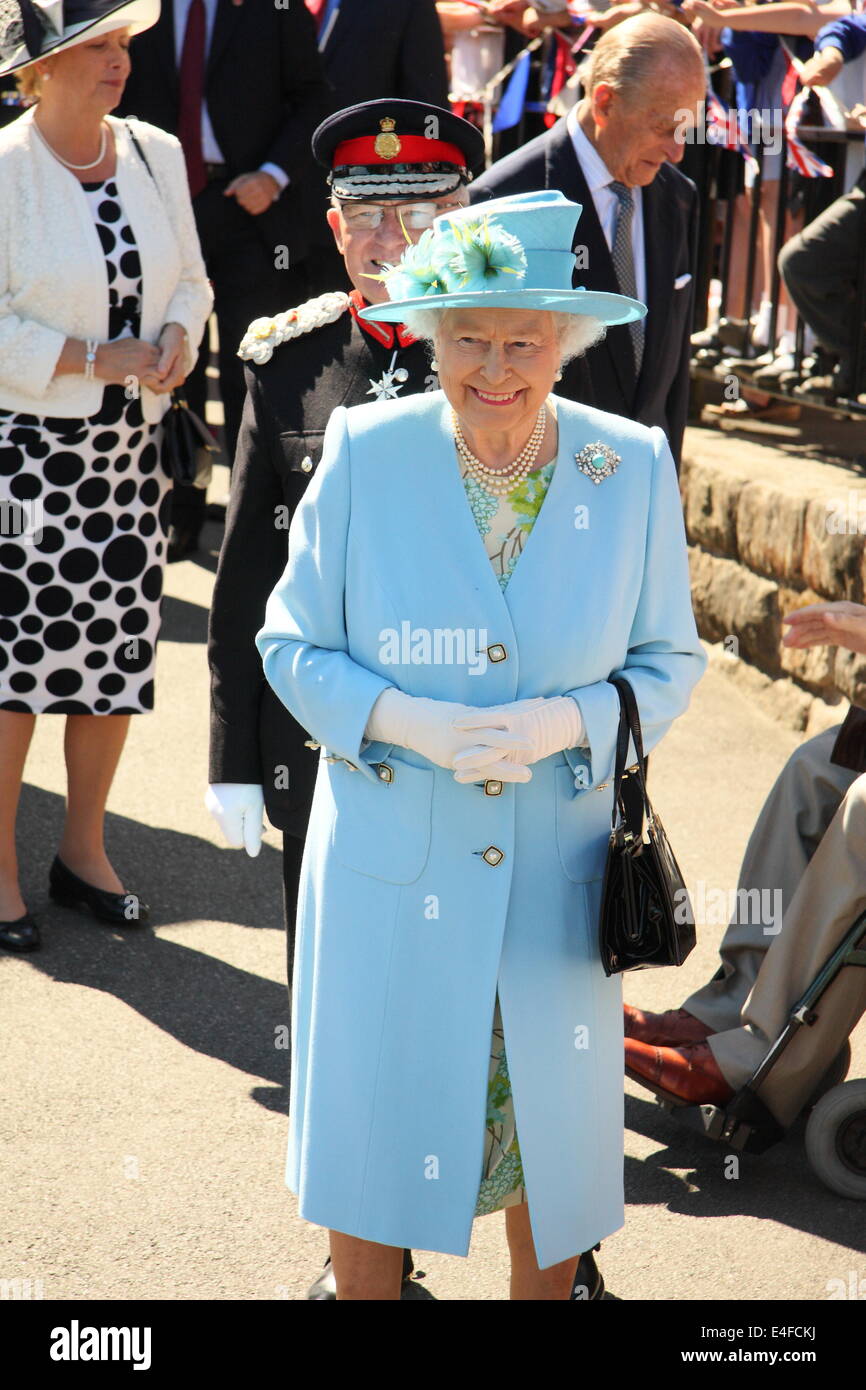 Matlock, Derbyshire, UK. 10th July 2014.  Queen Elizabeth II and the Duke of Edinburgh are received by Mr. William Tucker, Lord-Lieutenant of Derbyshire on arrival at Matlock Station ahead of a visit to luxury knitwear manufacturer, John Smedley and Chatsworth House. Credit:  Matthew Taylor/Alamy Live News Stock Photo
