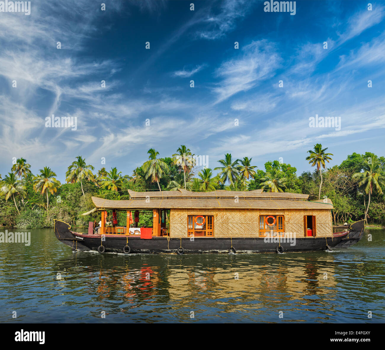 Travel tourism Kerala background - houseboat on Kerala backwaters. Kerala, India Stock Photo