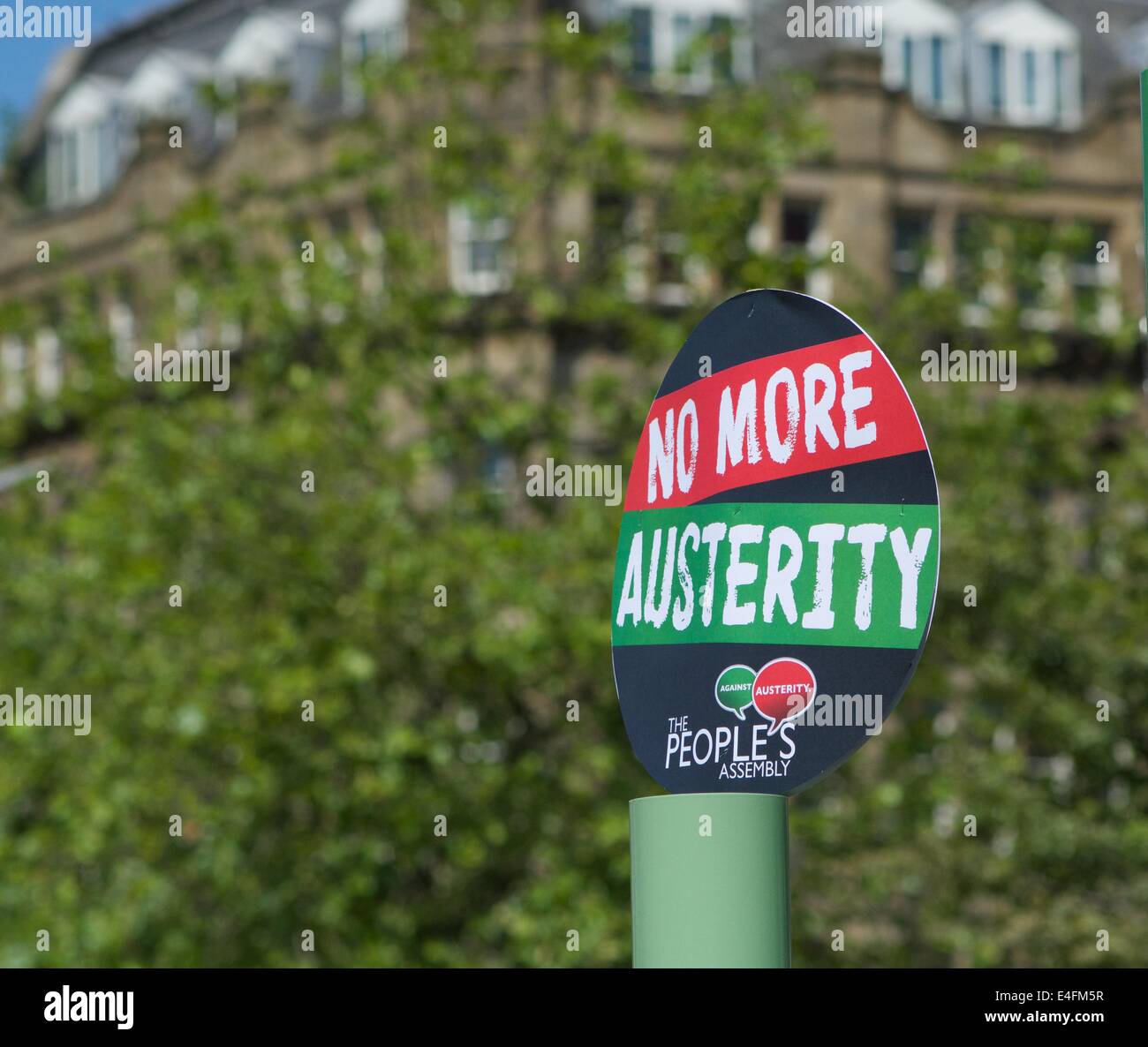 Manchester, UK 10th July Public sector workers on strike to protest against low pay and poor conditions hold a rally in Piccadilly Gardens and put up a notice campaigning against austerity measures. Public Sector Strike  Manchester, UK Credit:  John Fryer/Alamy Live News Stock Photo