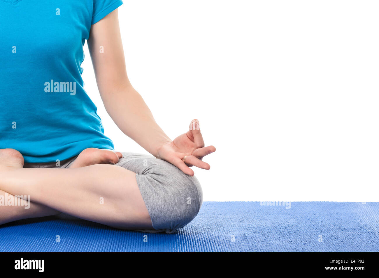 Close up of yoga Padmasana (Lotus pose) cross legged position for meditation with Chin Mudra - psychic gesture of consciousness Stock Photo
