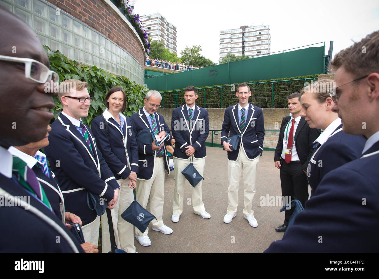 Linesman and umpires before a match at Wimbledon Tennis Championships 2014, Southwest London, England, UK Stock Photo