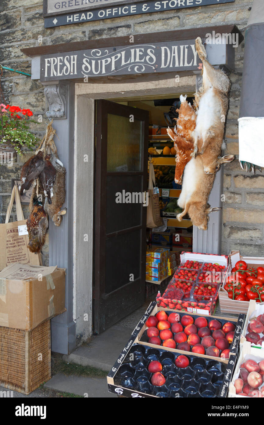 Pheasants and rabbits hanging up outside Hankins Store in Hayfield, Derbyshire, England, UK. Stock Photo