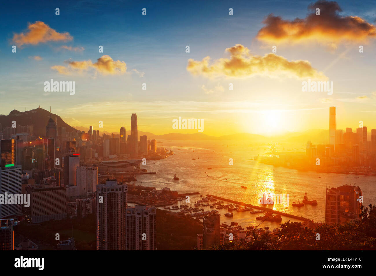 Hong Kong sunset with office buildings Stock Photo - Alamy