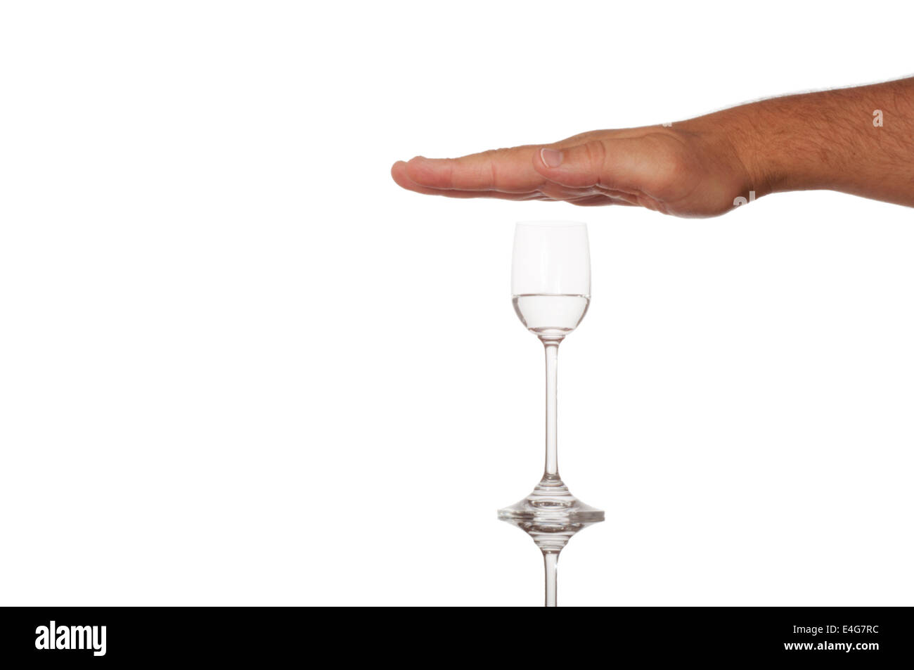 Hand over liquor glass - stop alcoholism concept Stock Photo