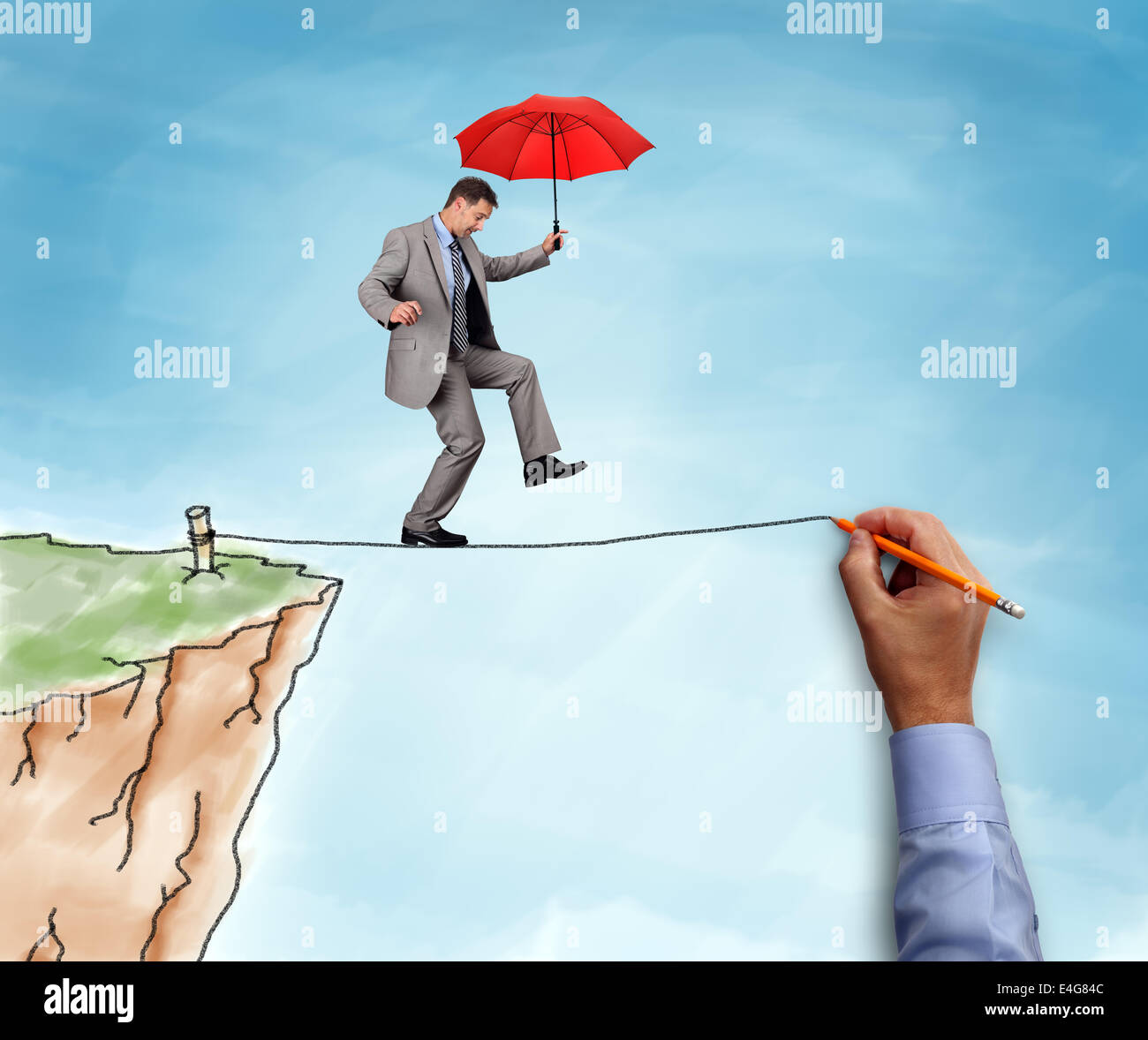 Businessman on a tightrope Stock Photo
