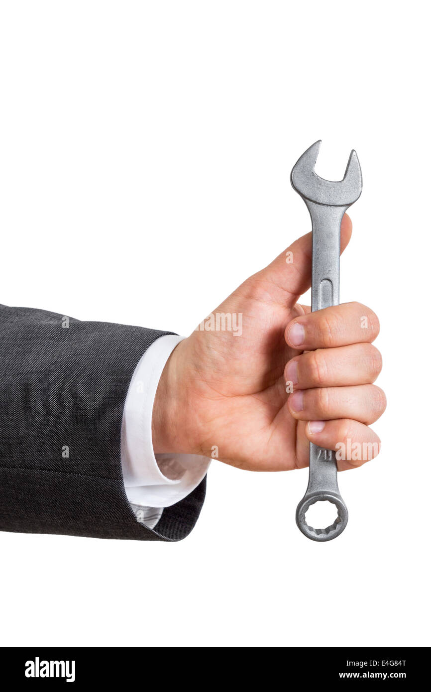 isolated arm of a business man holding a silver wrench Stock Photo - Alamy