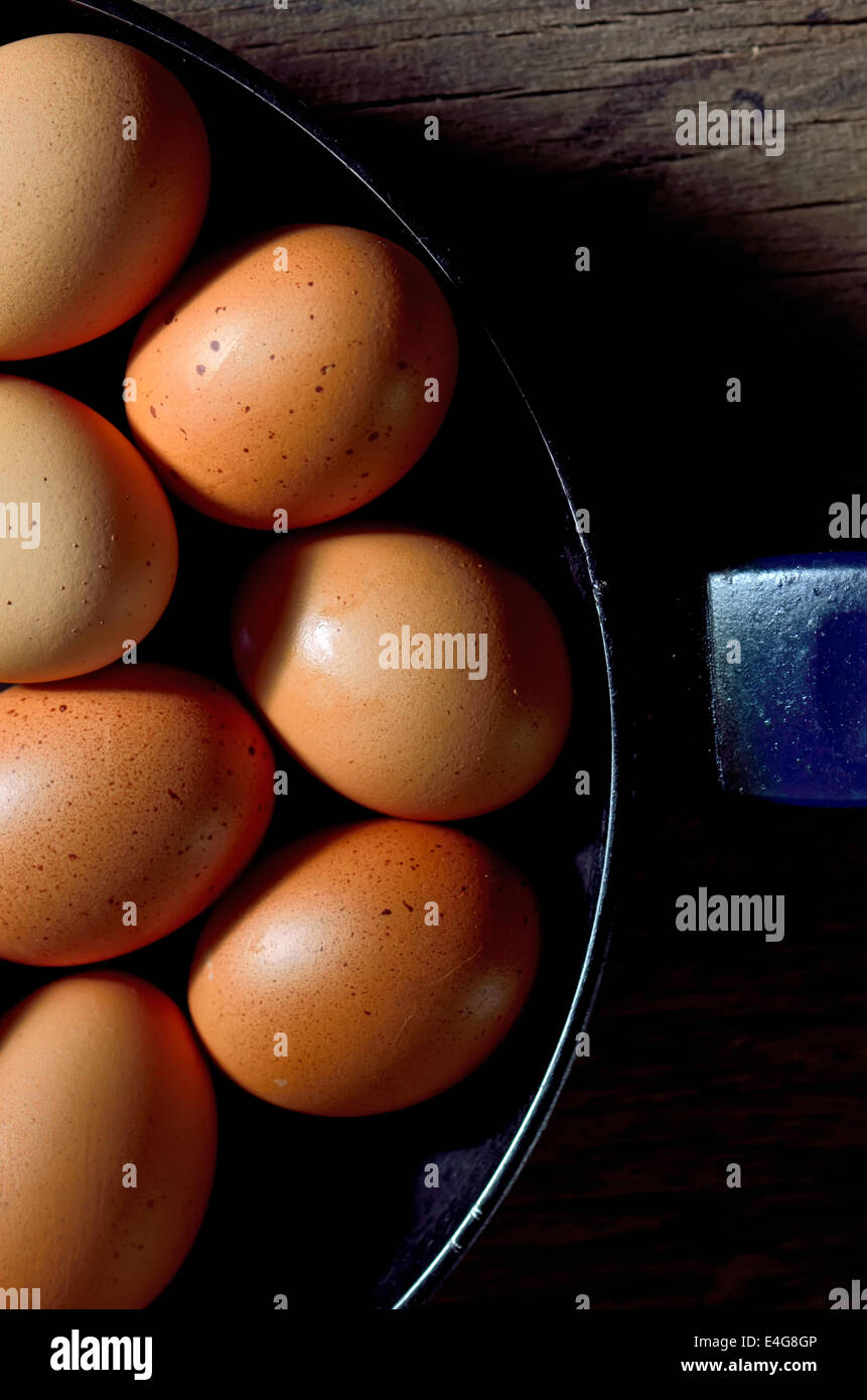 Whole brown egg in cast pan fried Stock Photo