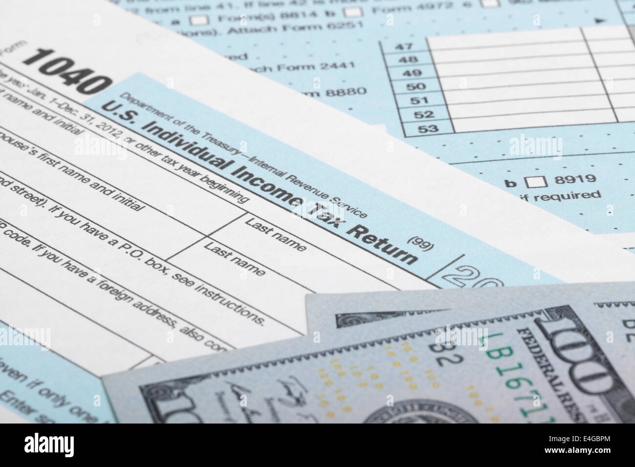 Tax Form 1040 with 100 US dollar bills Stock Photo - Alamy