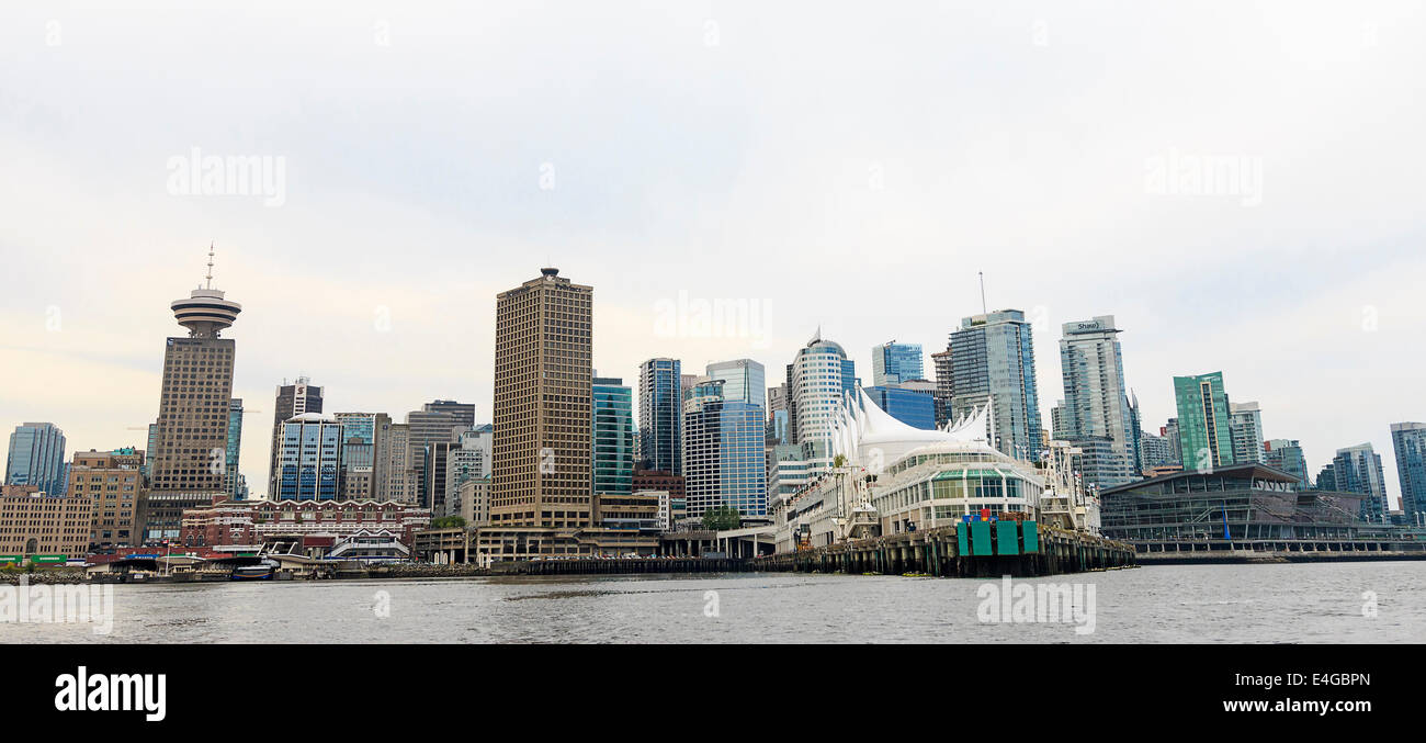 City skyline of Vancouver, British Columbia, Canada, as seen from the water. Pan Pacific Hotel and Vancover Convention Center Stock Photo