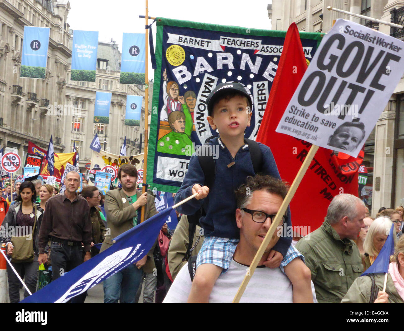 London, UK. 10th July, 2014. Public sector workers and their families march toward Trafalgar Square during a day of strike action to demonstrate against government policies on pay, pensions and cuts in services.  Over a million union members across the country were estimated to have taken industrial action to protest against the Government's austerity measures. Credit:  Deborah Roberts/Alamy Live News Stock Photo