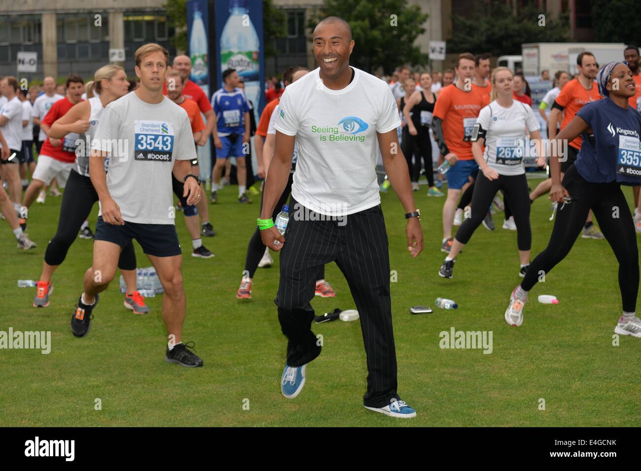 London, UK. 10th July, 2014. Colin Jackson warm up before the race at the Standard Chartered Great City Race 2014 in London. Credit:  See Li/Alamy Live News Stock Photo