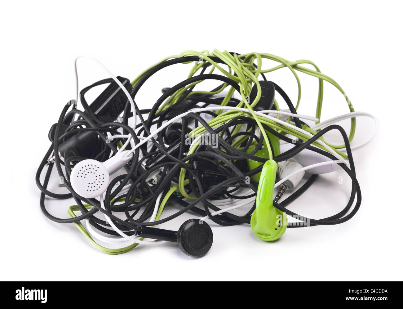 Twisted headphones, of different colors, on white background. Stock Photo