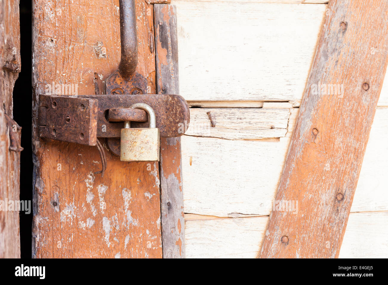Old rusty padlock on a wooden door Stock Photo - Alamy