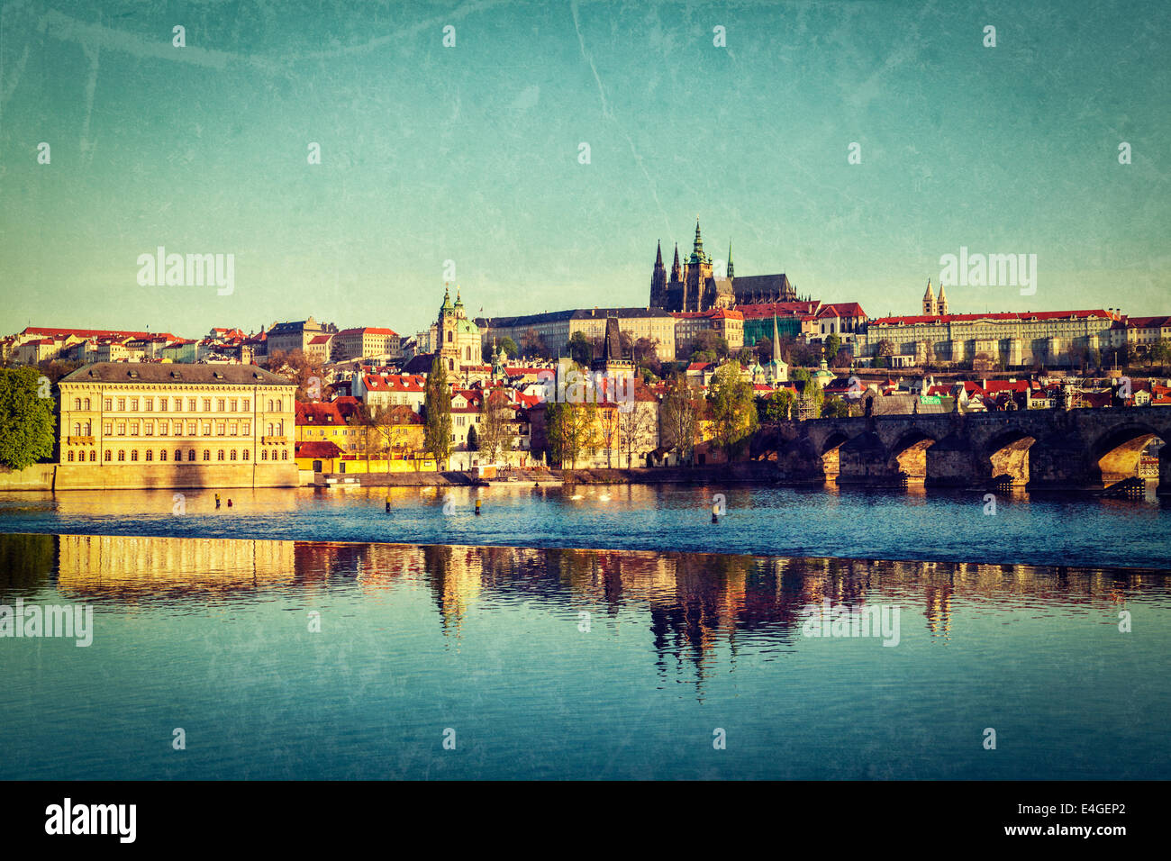 Vintage retro hipster style travel image of Mala Strana and  Prague castle over Vltava river with grunge texture overlaid. Pragu Stock Photo