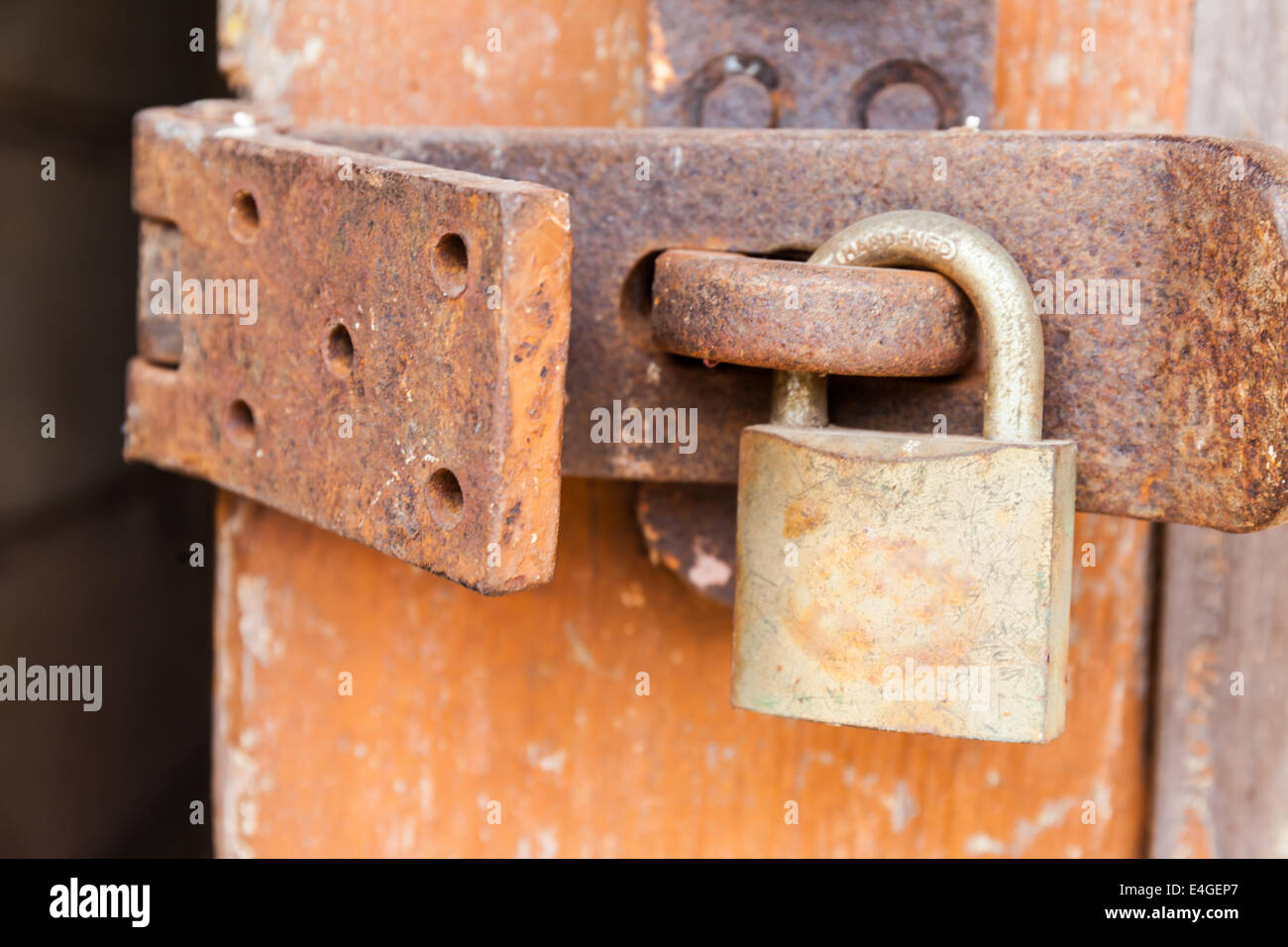 Old rusty padlock on a wooden door Stock Photo - Alamy
