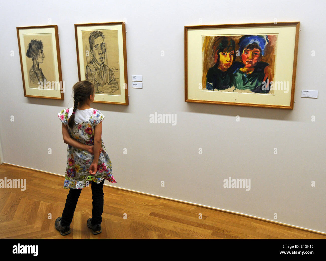 A girl looks at drawings and paintings by Oskar Kokoschka (1886-1980) at the Galerie Neue Meister (lit. New Masters Gallery) in Dresden, Germany, 10 July 2014. The Gallery purchased the painting for 2,6 million Euro from a private owner. Photo: MATTHIAS HIEKEL/dpa Stock Photo
