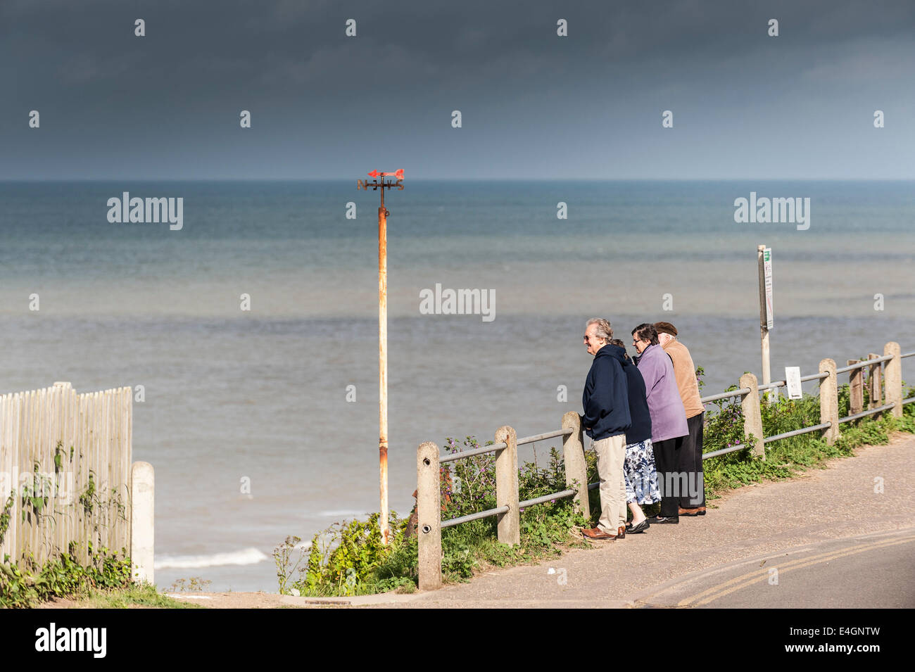 People looking out over Overstrand Beach. Stock Photo