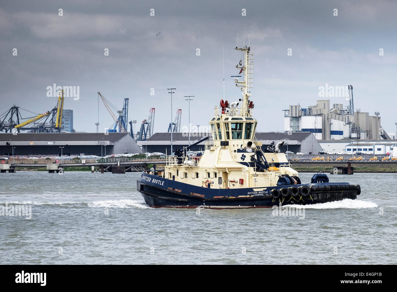 The tug Svitzer Bootle steaming downriver on the River Thames. Stock Photo
