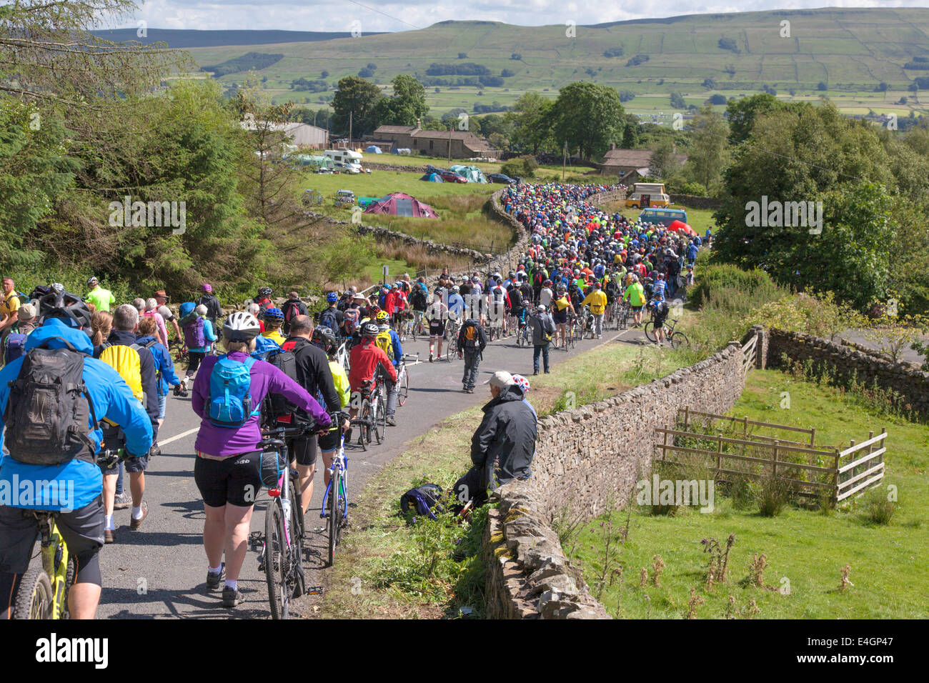 Spectators descend the Butter Tubs Pass after the Tour De France, July 2014 had passed near Hawes, North Yorkshire, England, UK Stock Photo