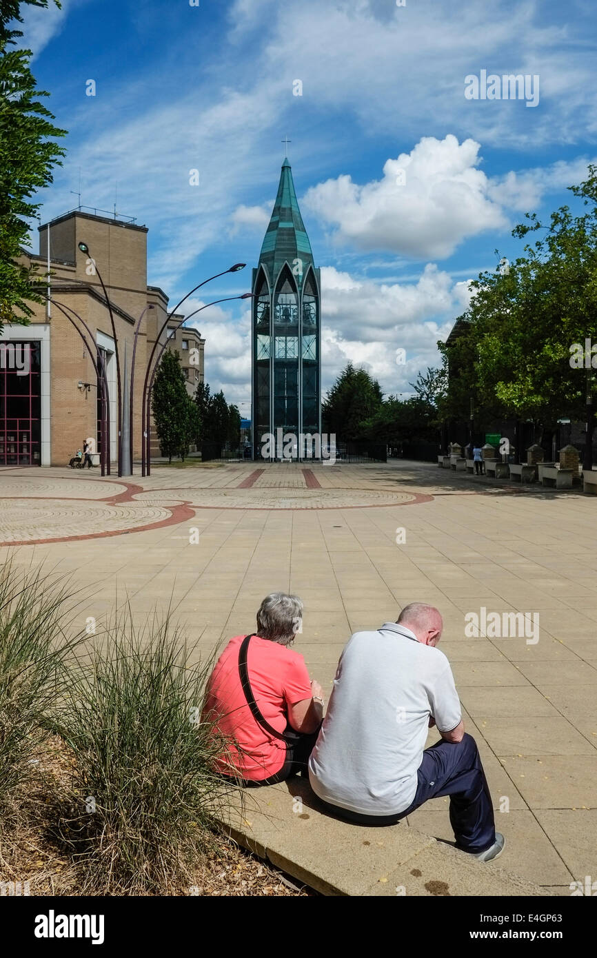 Two people sitting in St Martins Sqaure in basildon Town centre. Stock Photo