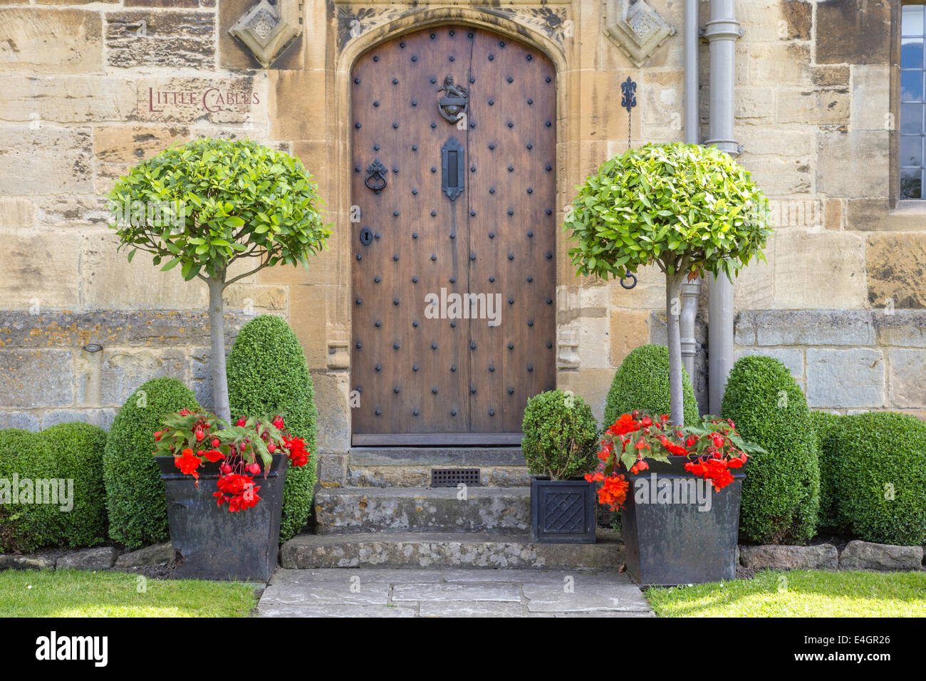 Ornate door entrance on a Cotswold manor house, England, UK Stock Photo