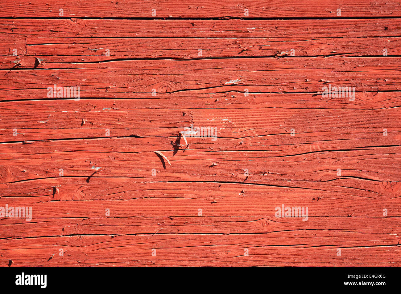 Old wood  planks with a rust red brown peeling paint wash background Stock Photo