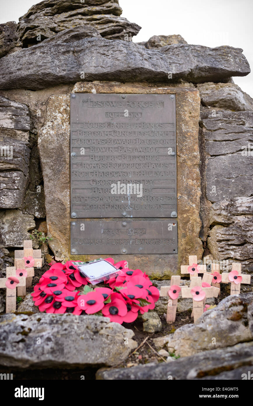 A metal War Memorial with poppies and wooden crosses, Poppleton, near York, UK. Stock Photo