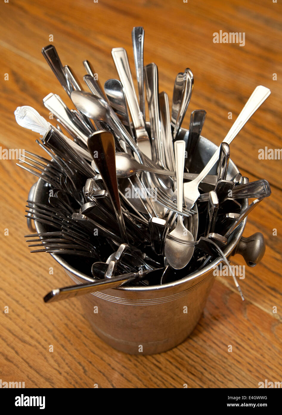 Cutlery in ice bucket Stock Photo Alamy