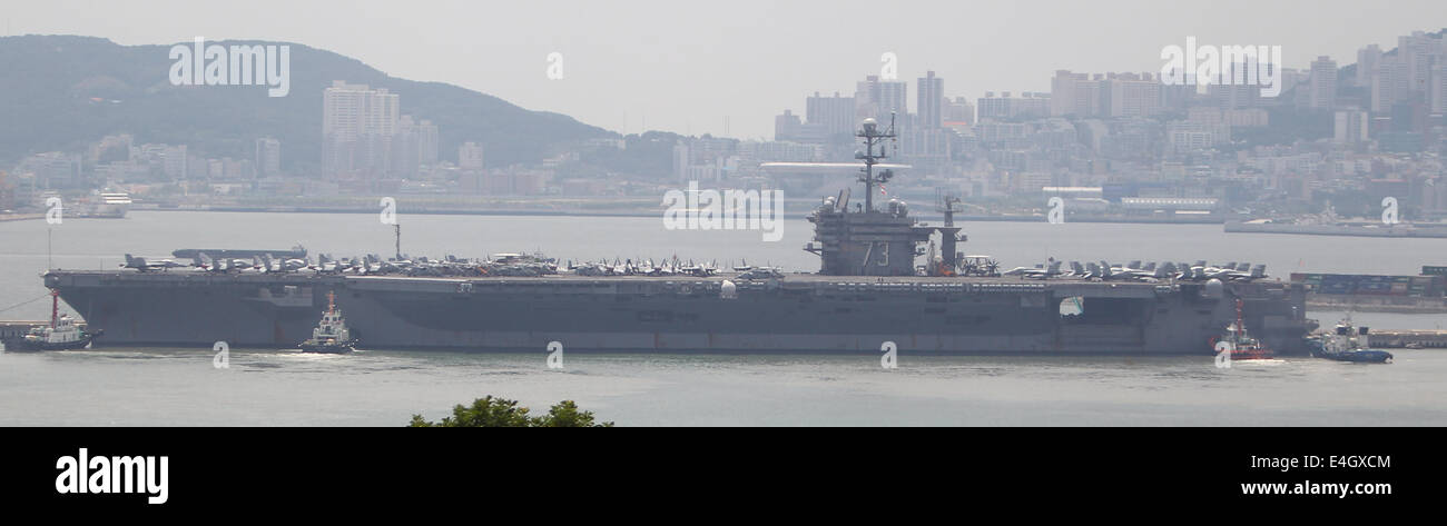 Busan, South Korea. 11th July, 2014. US nuclear powered aircraft carrier USS George Washington is seen at a naval port in the southeastern port city of Busan, South Korea, July 11, 2014. The U.S. Navy's aircraft carrier USS George Washington would make a five-day port call to South Korea's southern port city of Busan from Friday and carry out a joint naval exercise with South Korea and Japan. Credit:  Yao Qilin/Xinhua/Alamy Live News Stock Photo
