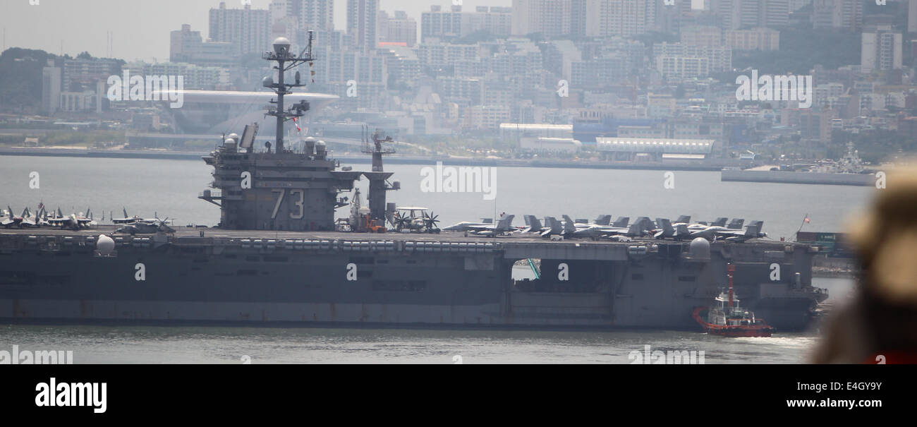 Busan, South Korea. 11th July, 2014. US nuclear powered aircraft carrier USS George Washington is seen at a naval port in the southeastern port city of Busan, South Korea, July 11, 2014. The U.S. Navy's aircraft carrier USS George Washington would make a five-day port call to South Korea's southern port city of Busan from Friday and carry out a joint naval exercise with South Korea and Japan. Credit:  Yao Qilin/Xinhua/Alamy Live News Stock Photo