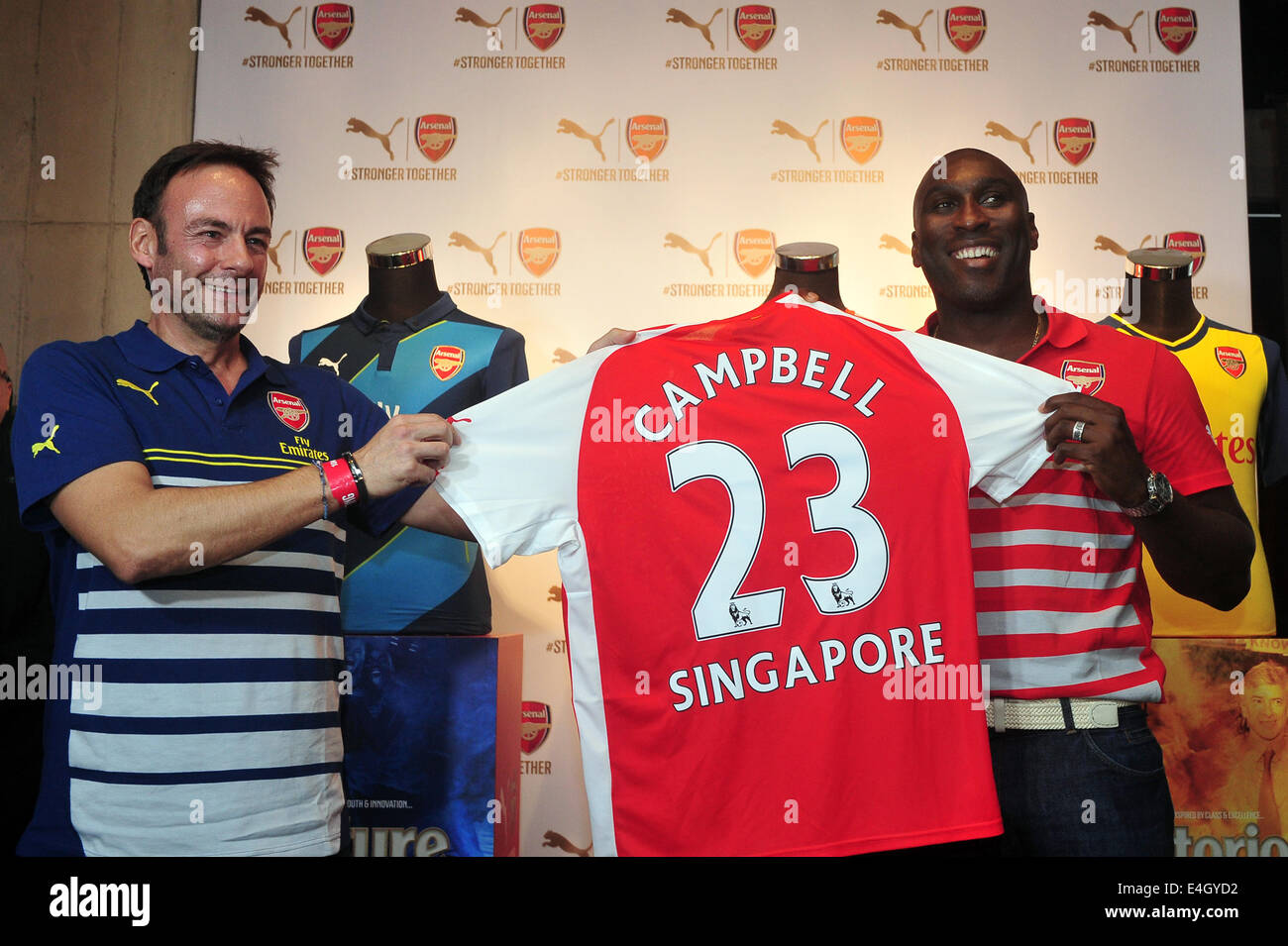 Singapore. 11th July, 2014. Former Arsenal player Sol Campbell (R) attends the Arsenal's new kit launch in Singapore, July 11, 2014. Credit:  Then Chih Wey/Xinhua/Alamy Live News Stock Photo